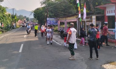 Babinsa Koramil 0106/Menes Amankan Gerak Jalan Sehat dan Tasyakuran “Jalan Bang Andra”